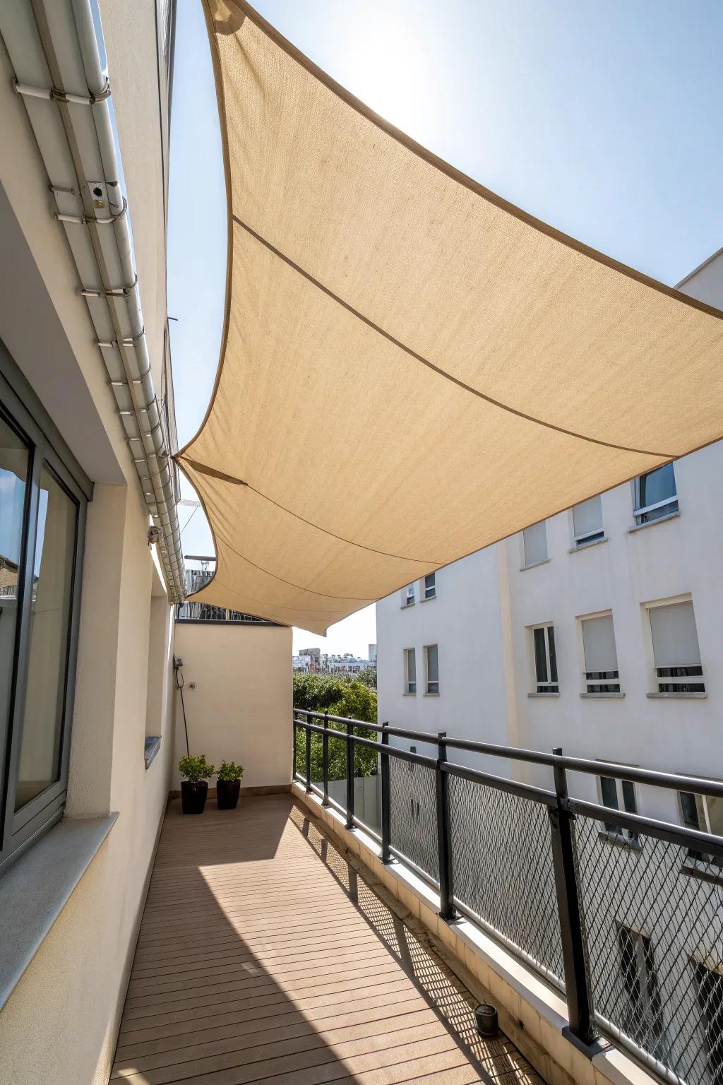 Tailored rectangular shade sail—angled for runoff and casting crisp, cozy balcony shadows.