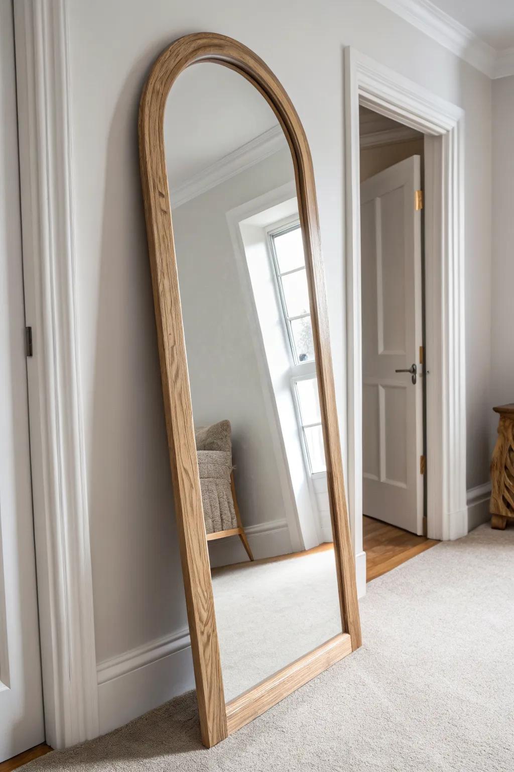 Light oak arched mirror + soft greige walls: a brighter, calmer bedroom hallway in seconds.