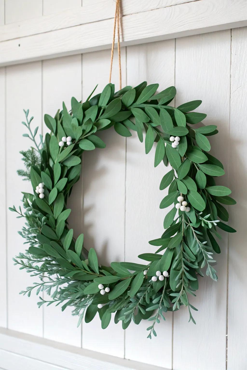 Embrace simplicity and beauty with this handmade paper mistletoe wreath.