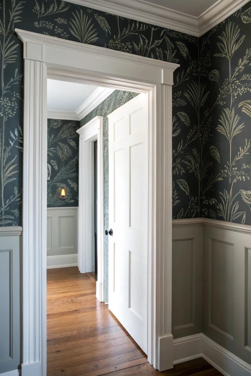 Moody dark wallpaper + crisp white trim makes a narrow hallway feel like a cozy gallery corridor.