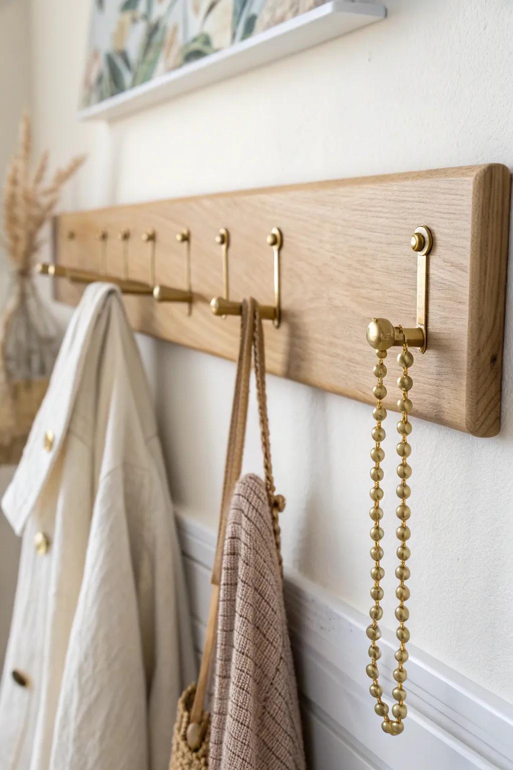 A sleek oak-and-brass hook rail keeps bracelets visible, untangled, and beautifully styled.