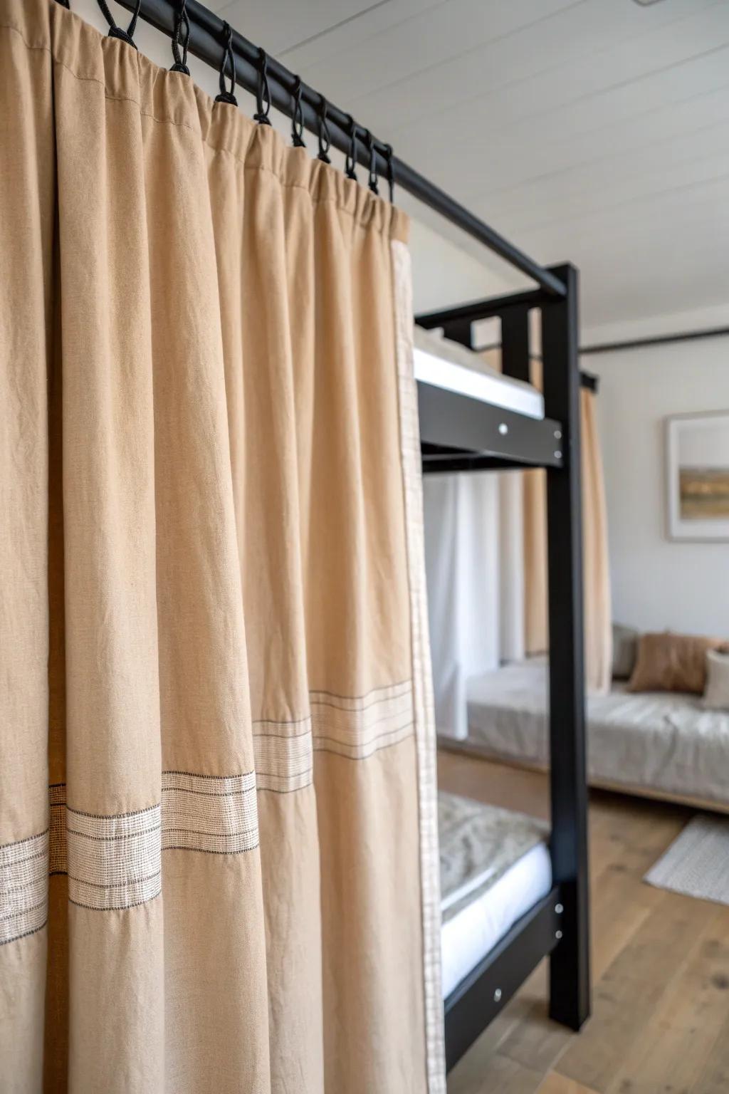 Linen privacy curtains turn each adult bunk into a calm, cozy little suite.