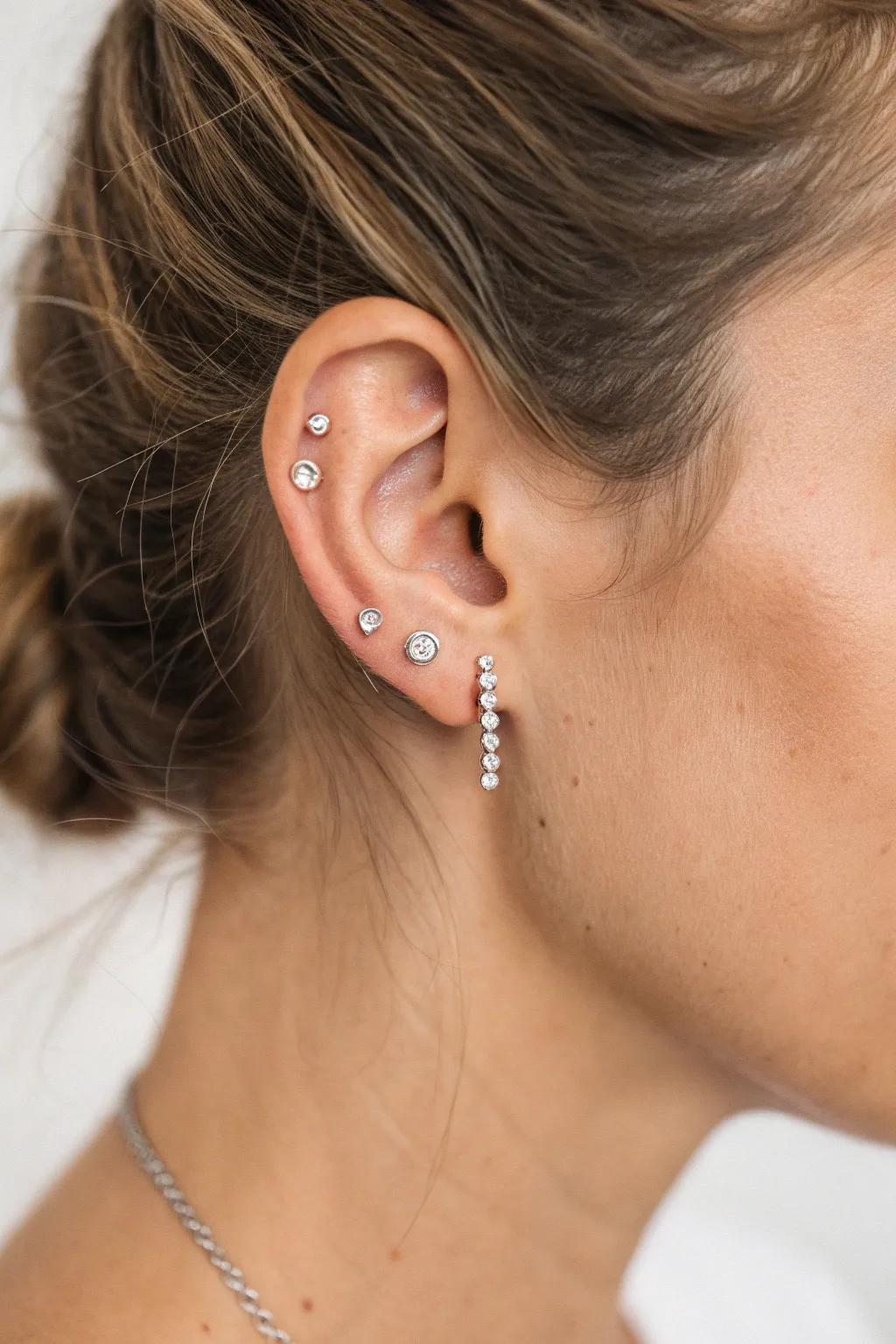 Embrace modern elegance with a minimalist linear stack of studs.