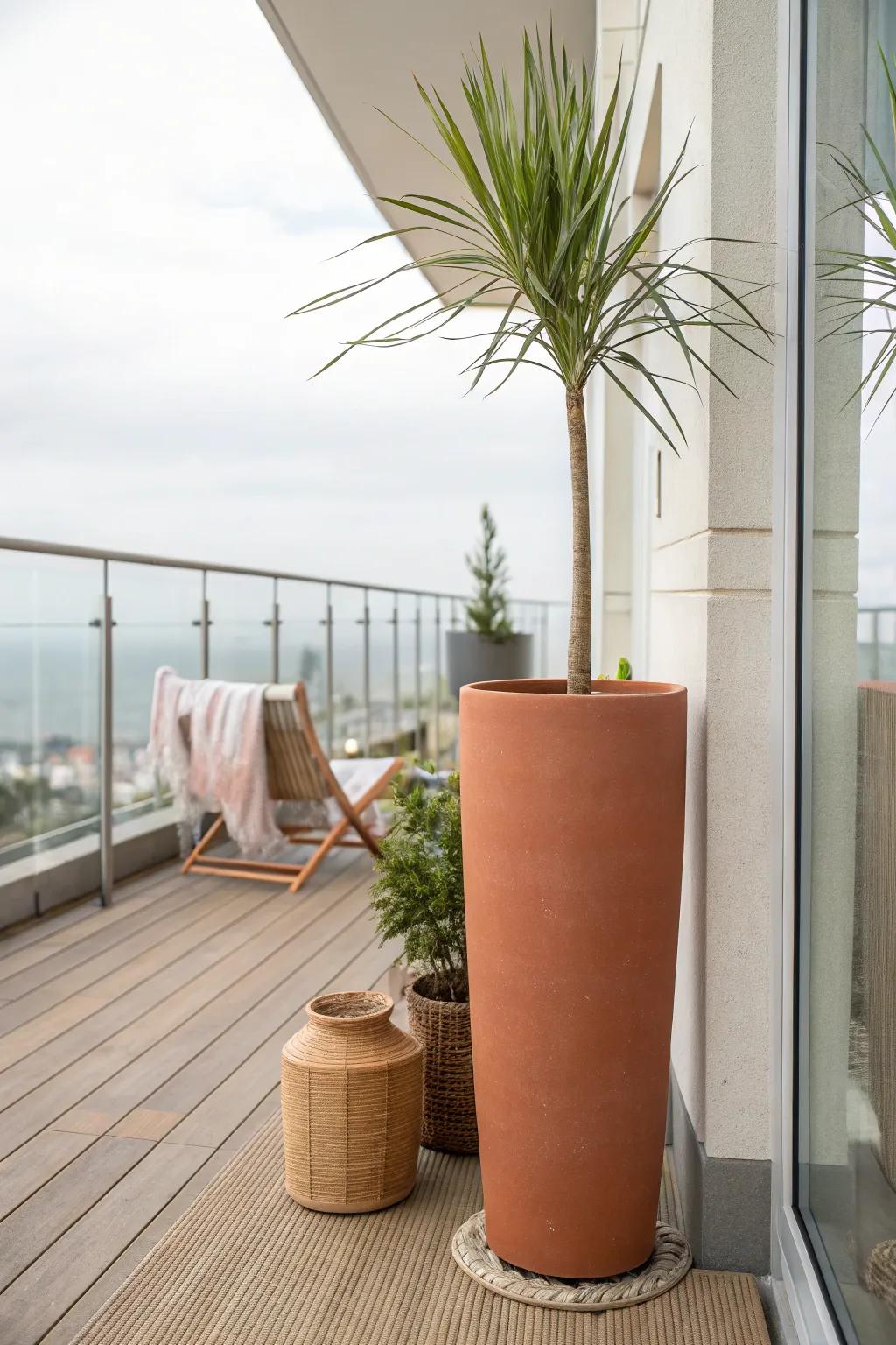 A tall planter adds breezy privacy—grounded, minimalist, and perfect for windy balconies.