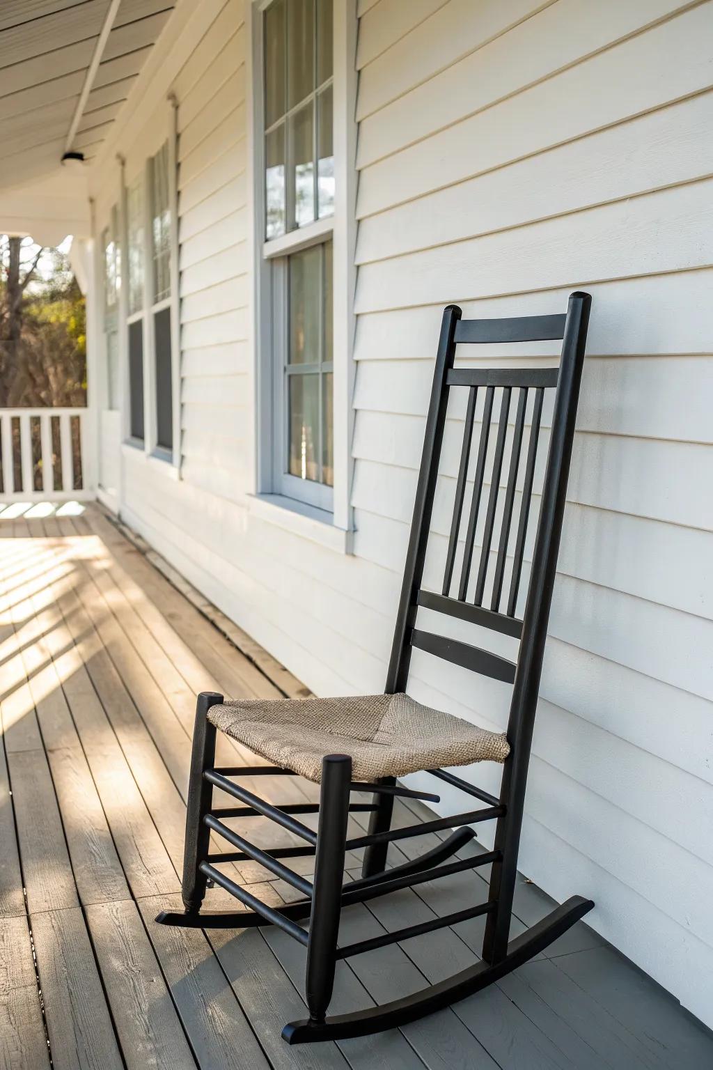 Slat-back metal chair keeps a tiny front porch airy, uncluttered—and dries fast after rain.