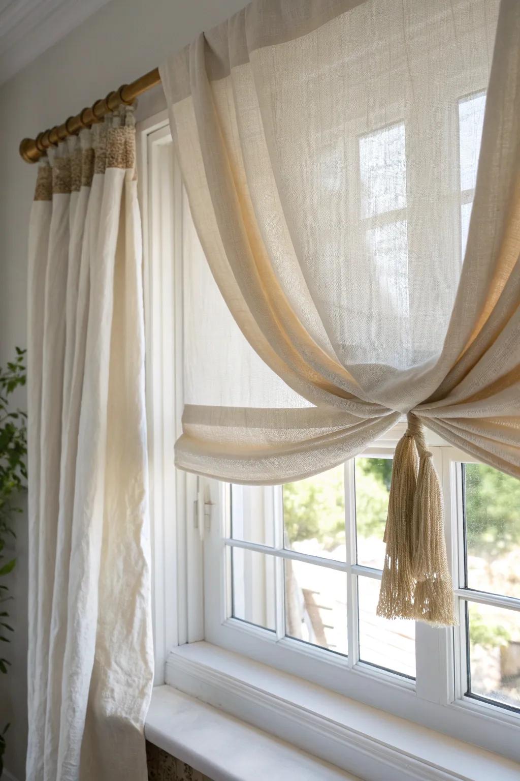 Layer Roman shades with soft linen drapes for a cozy-at-night, airy-by-day bay window.