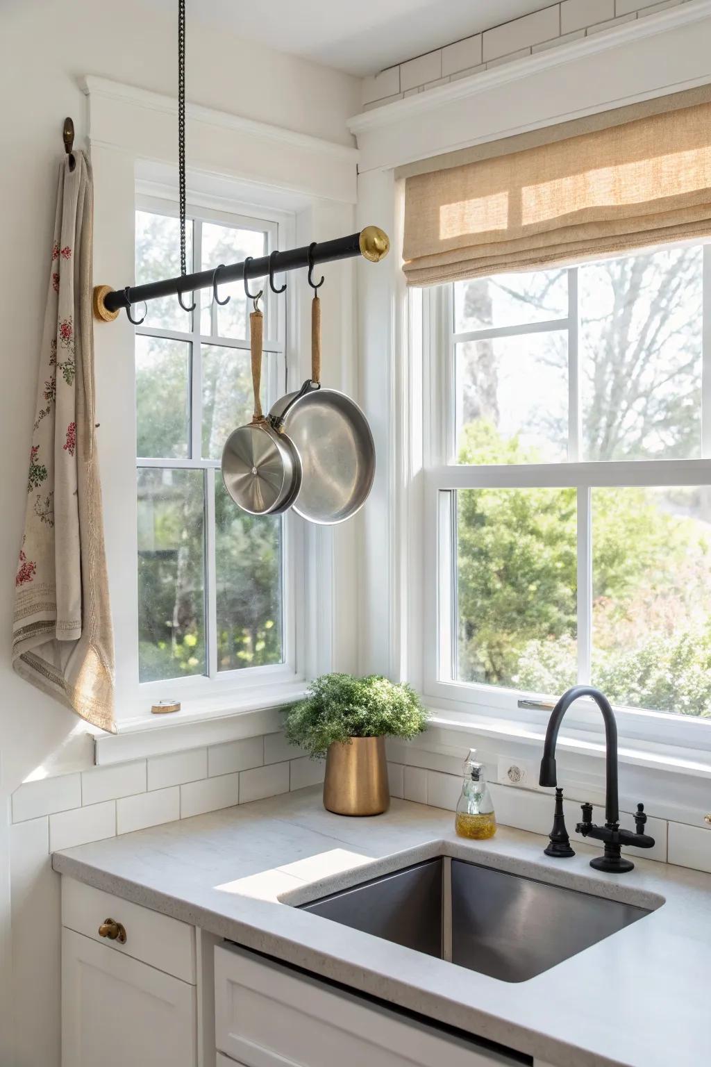 A sleek hanging rack over the sink window turns everyday pans into light-filled, minimal decor.