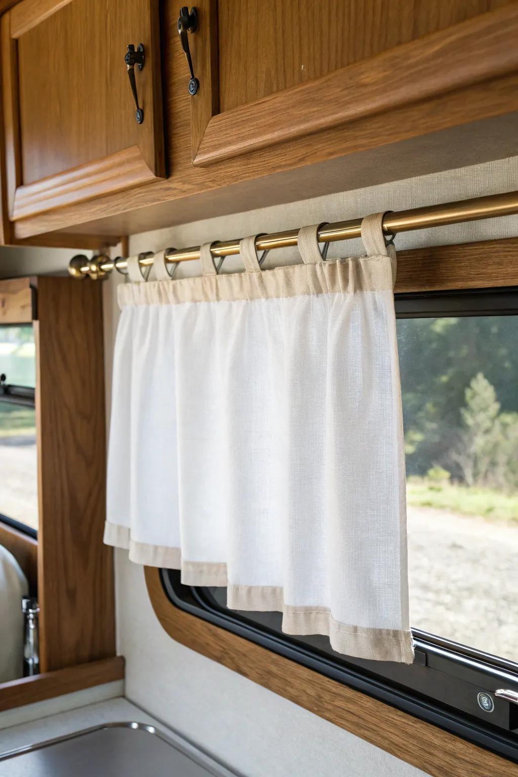 No-sew cafe curtains under a tidy RV valance—sunny privacy for tiny kitchen windows.