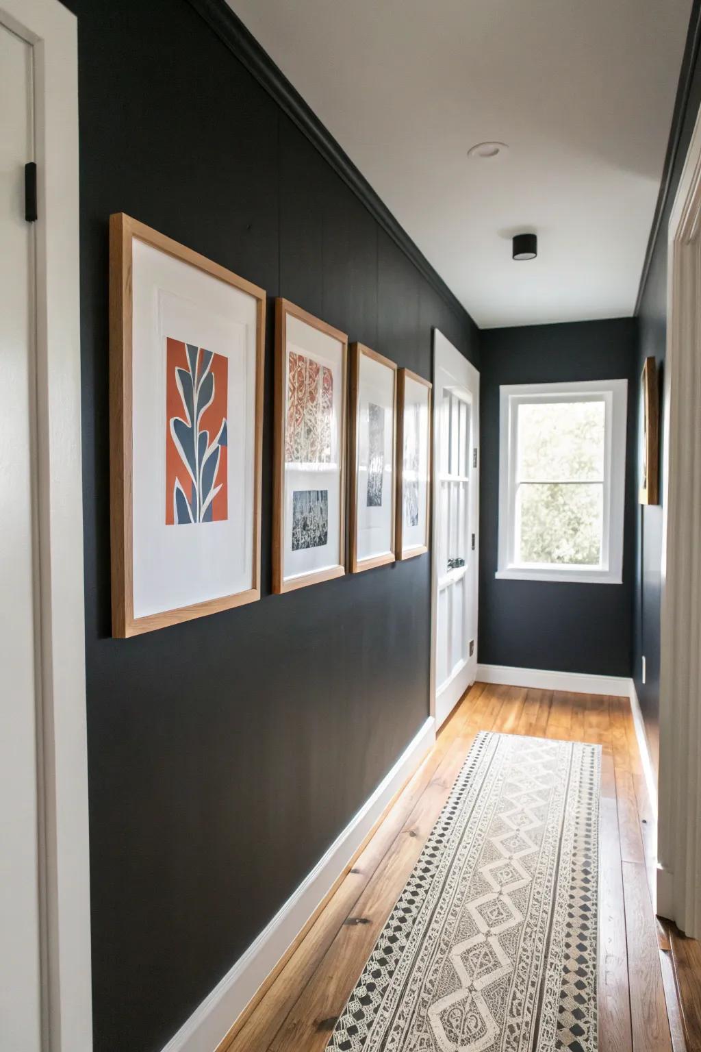 Light oak frames and white mats make art glow against a black hallway wall—simple, chic contrast.