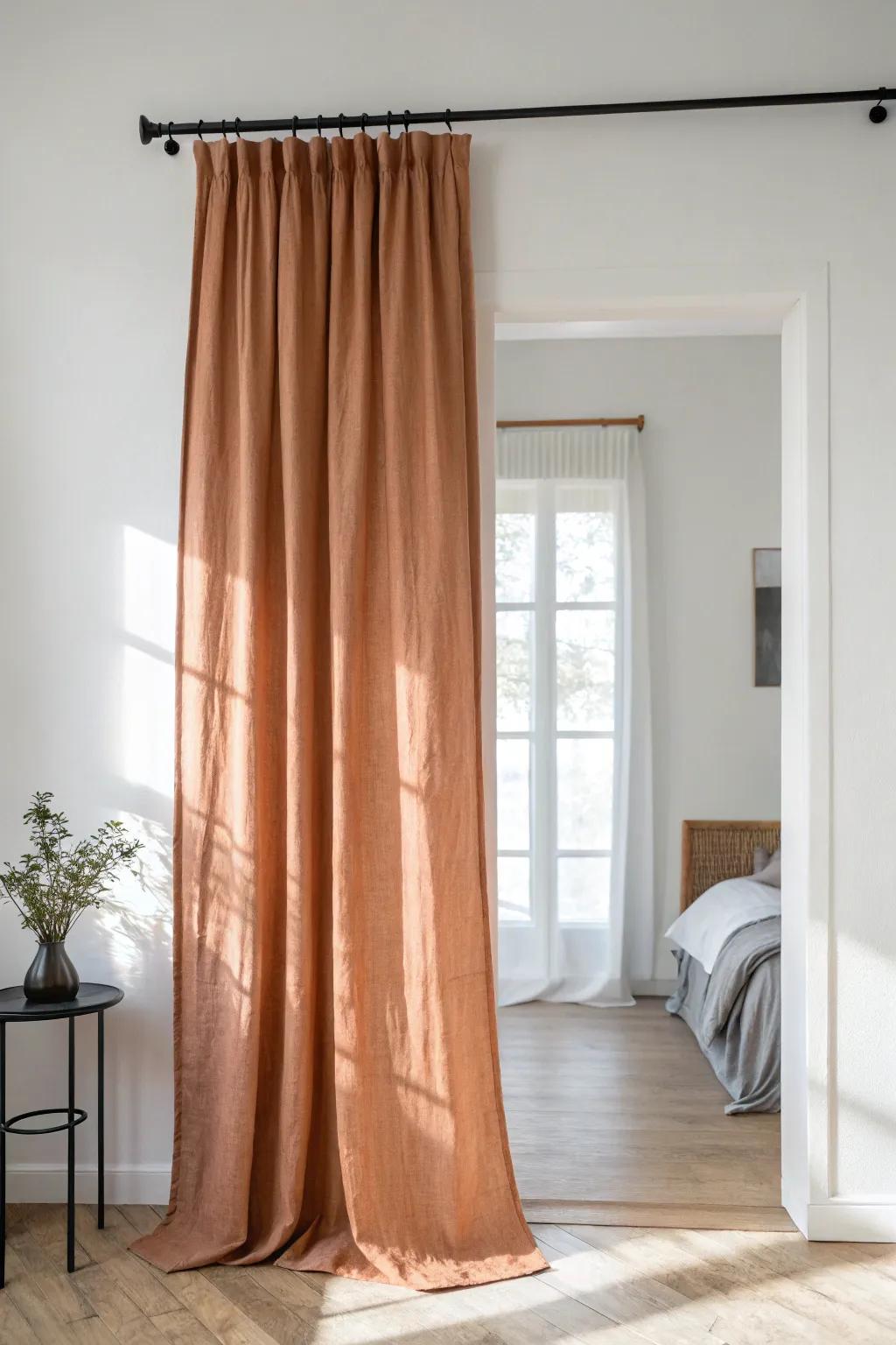Swap bulky closet doors for a high-hung linen curtain—rental-friendly and space-saving.