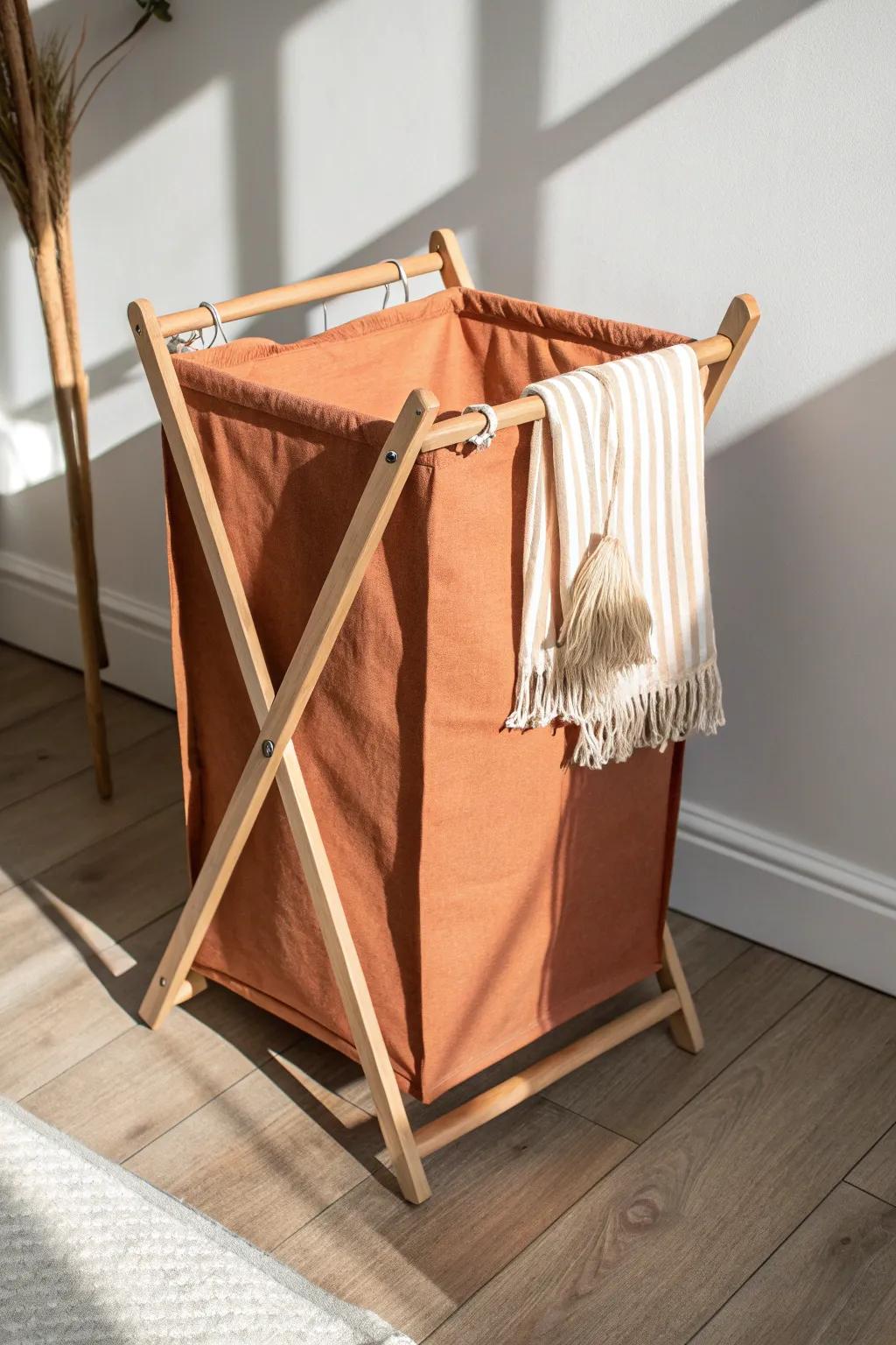 A chic collapsible laundry hamper that folds flat—small-space style with sturdy frame.