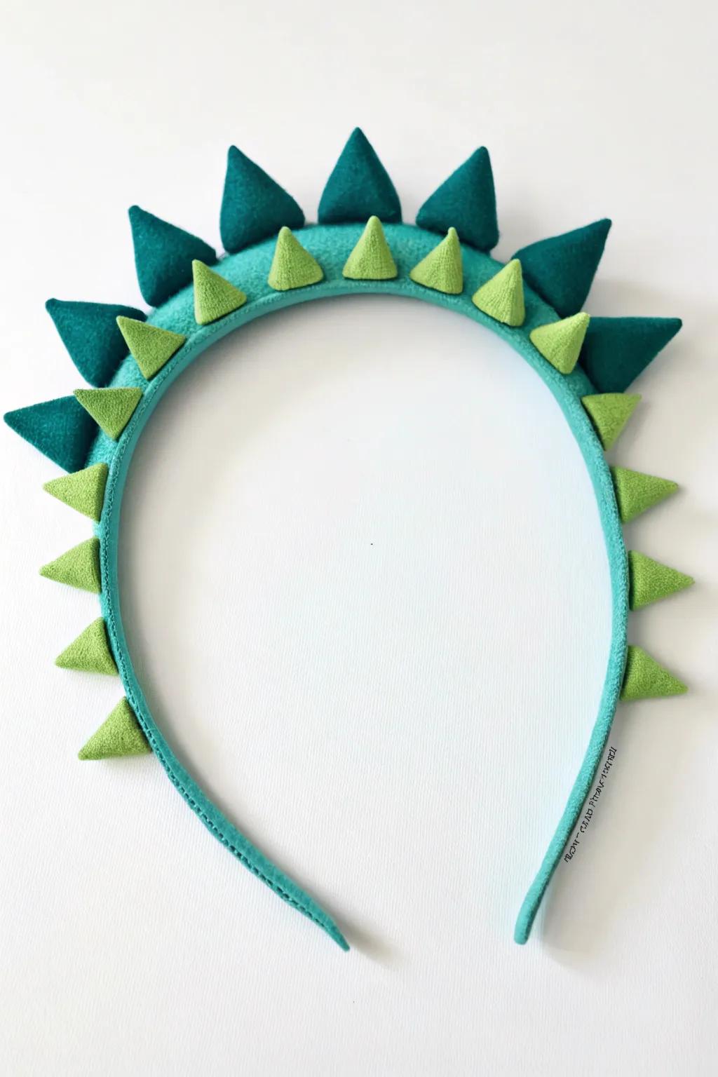 Unleash your inner dinosaur with this charmingly crafted headband!