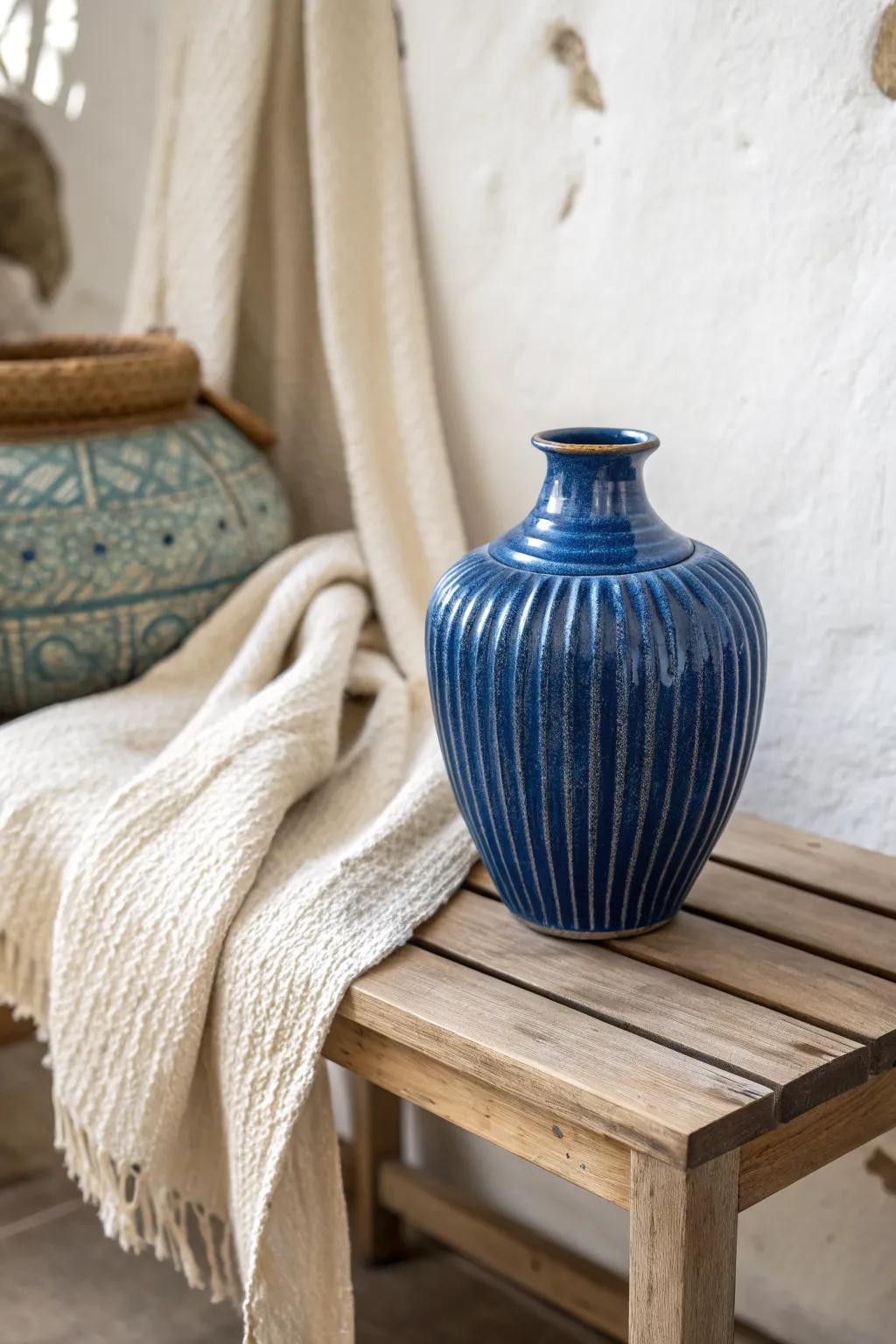 Tight palette, big impact: one bold ceramic piece + layered textures for modern small spaces.