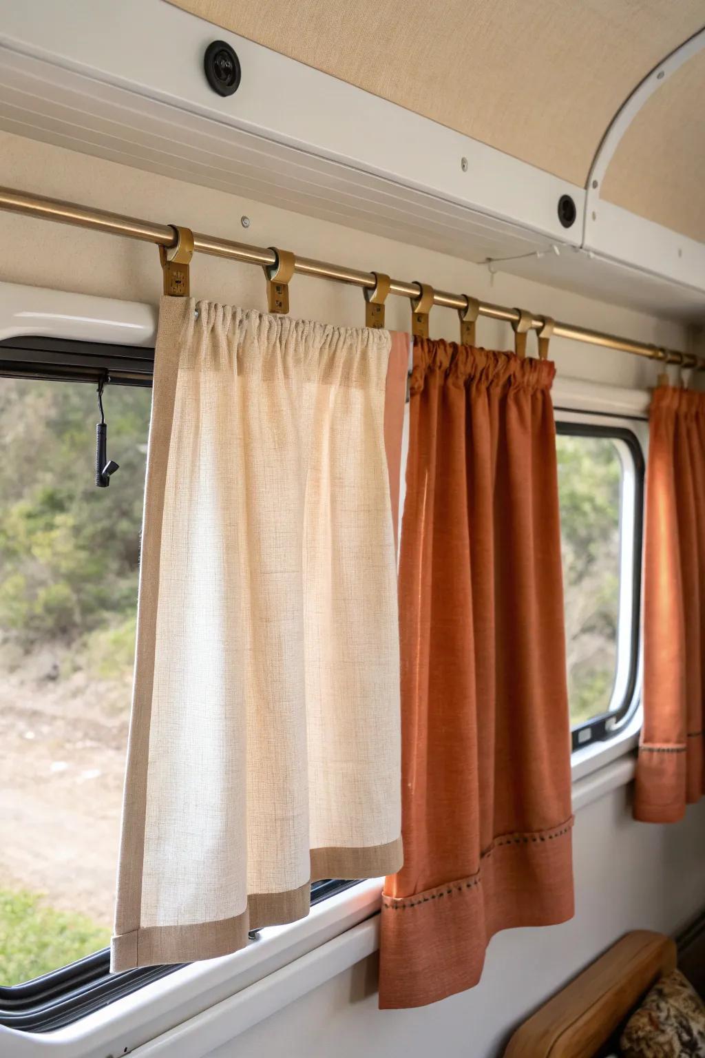 Sill-length RV curtains in bold linen keep pathways clear and make small spaces feel bigger.