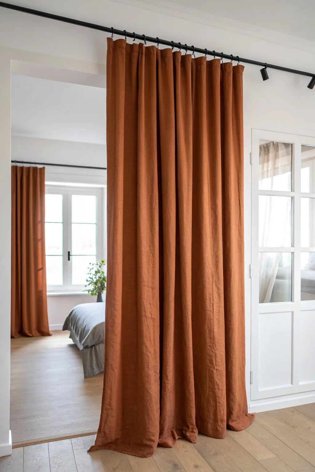 Linen curtain room divider: a renter‑friendly way to turn a studio into a calm sleep nook.