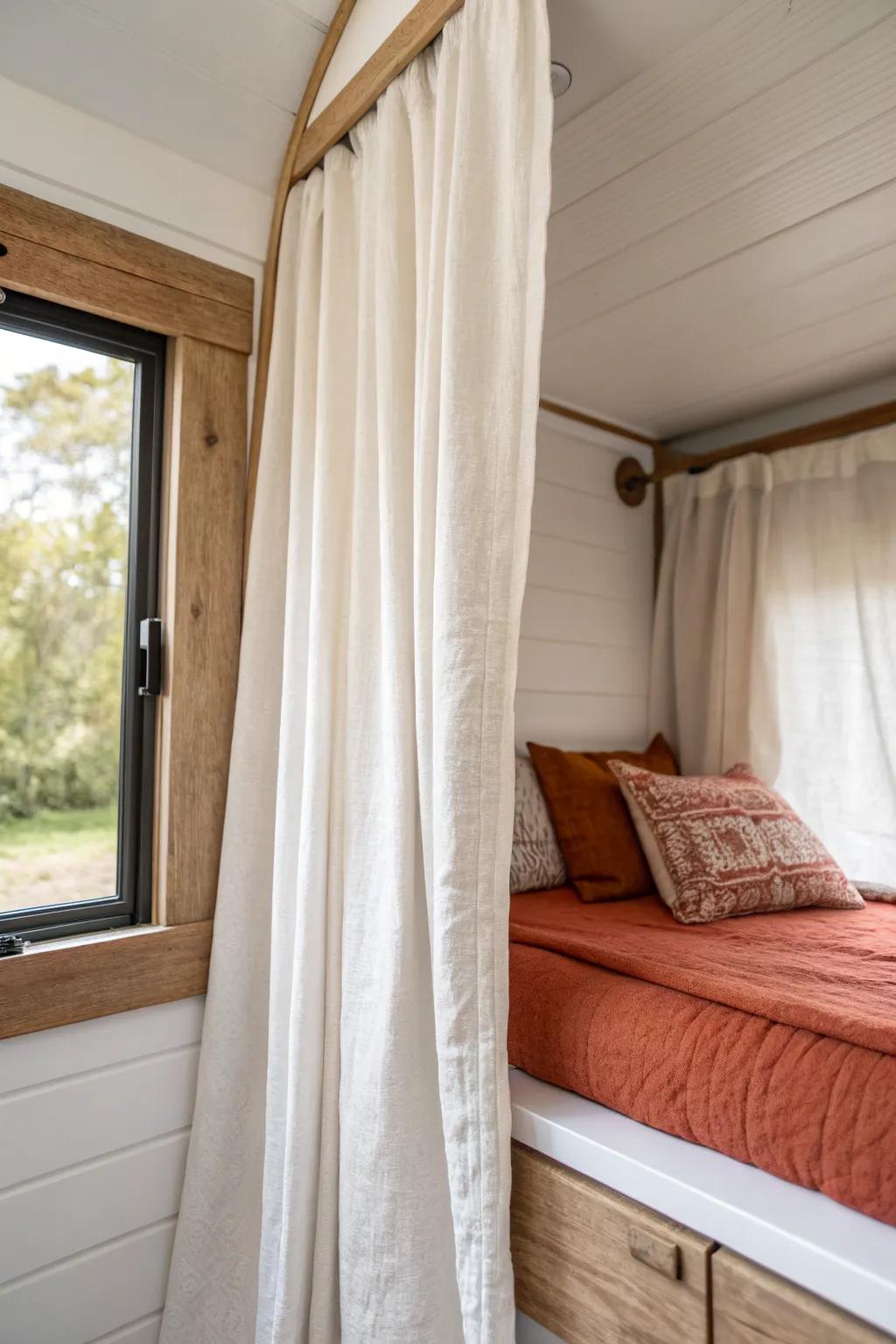 A linen curtain turns a built-in bed alcove into a calm, private nook—no extra walls needed.