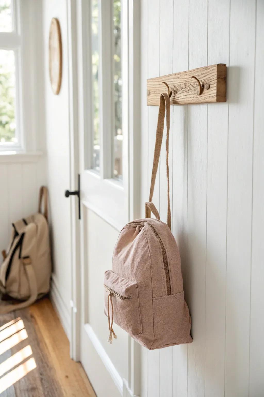 Kid-height wall hooks make it easy for little ones to hang bags and costumes—no chair piles.