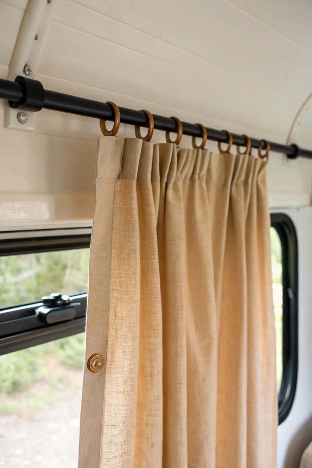 Relaxed tab-top linen curtains bring cozy, effortless style to a small camper window.