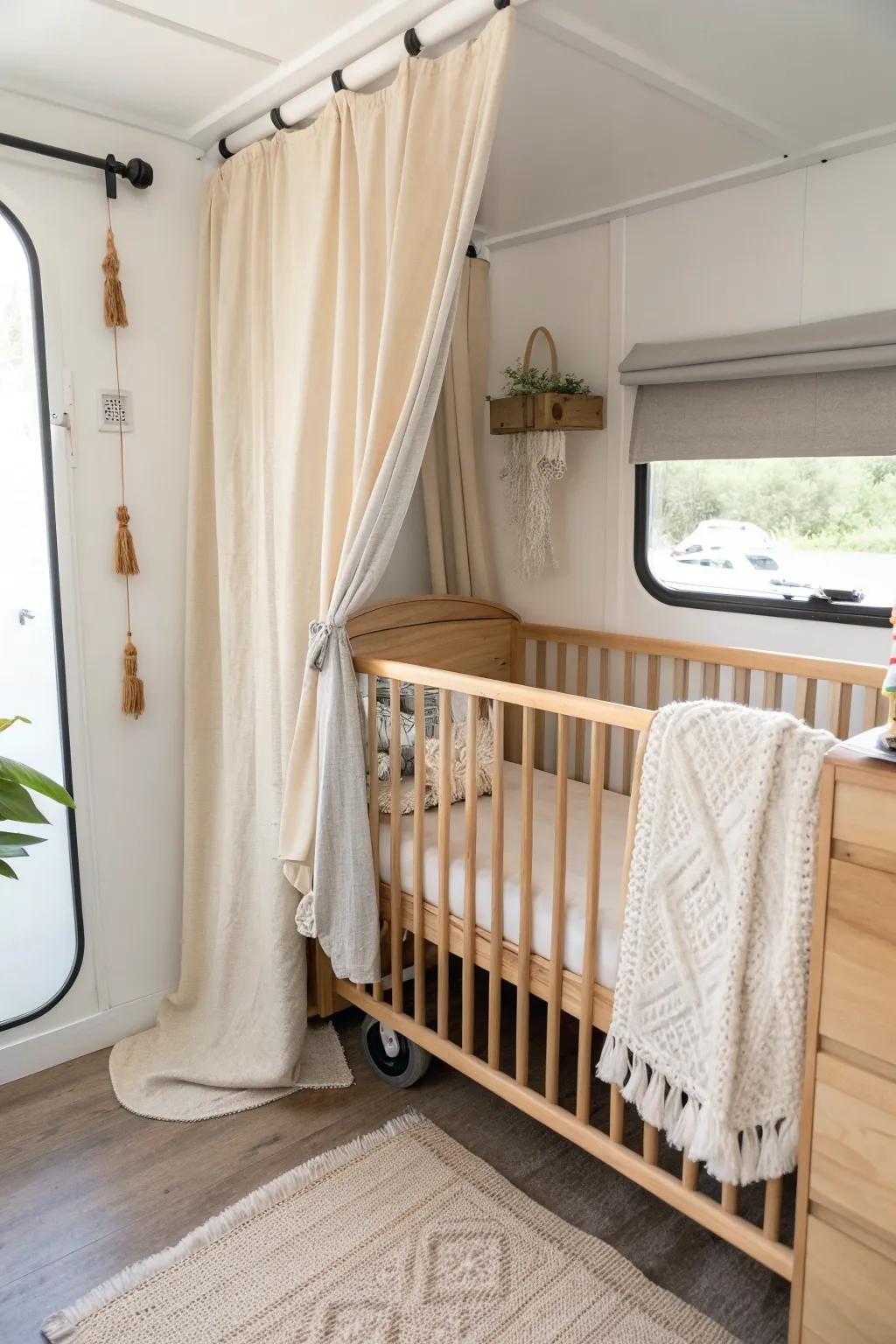 Curtain-closed RV crib nook—simple tension-rod privacy for nap time, still light and airy.