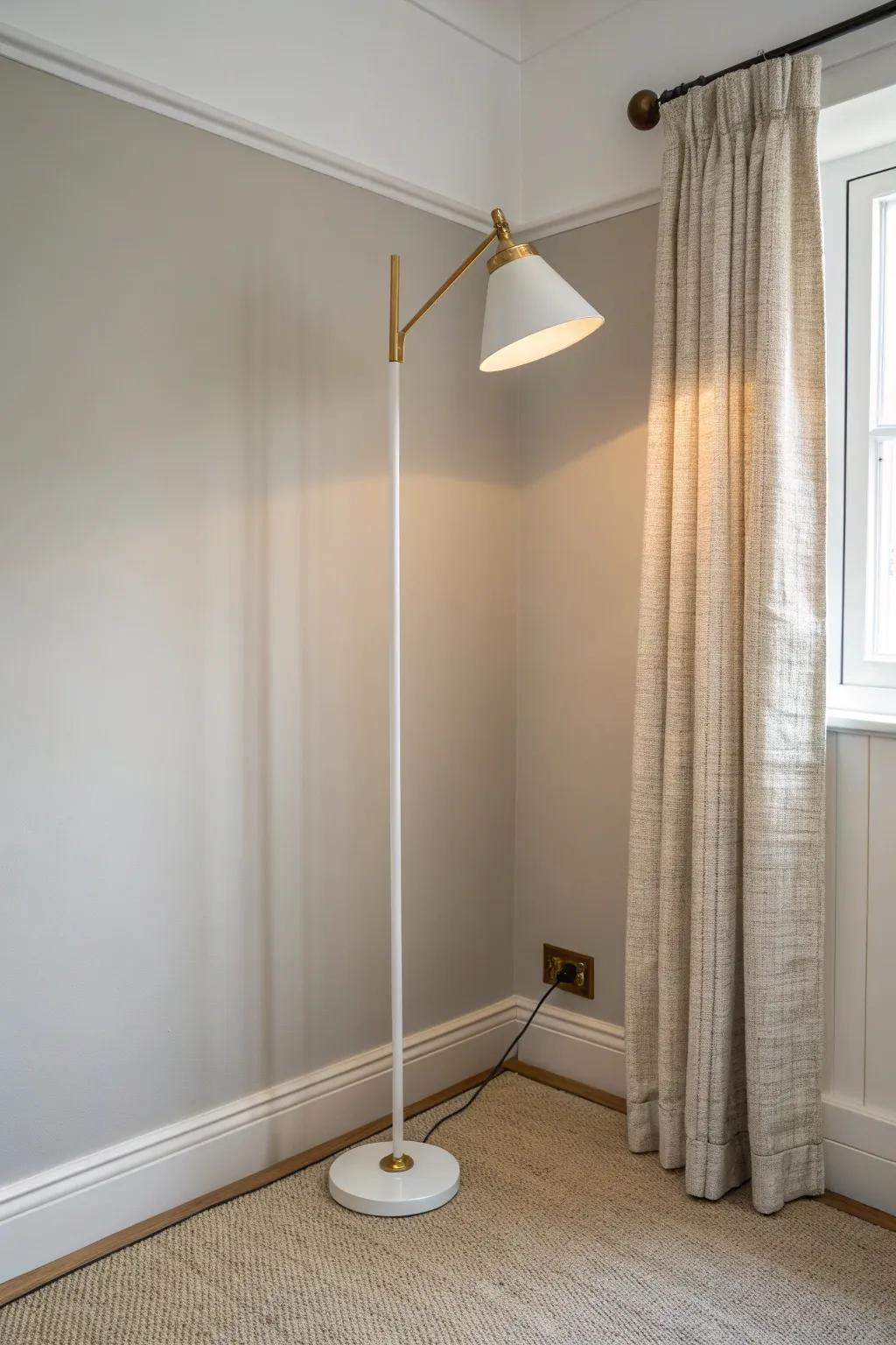 Tuck a slim uplight floor lamp in a corner to add glow and make walls feel farther apart.