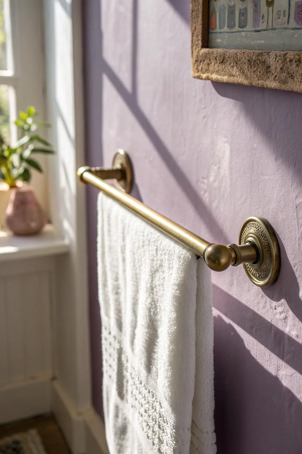 Brass hardware against dusty purple—small-bath detail that feels instantly luxe.